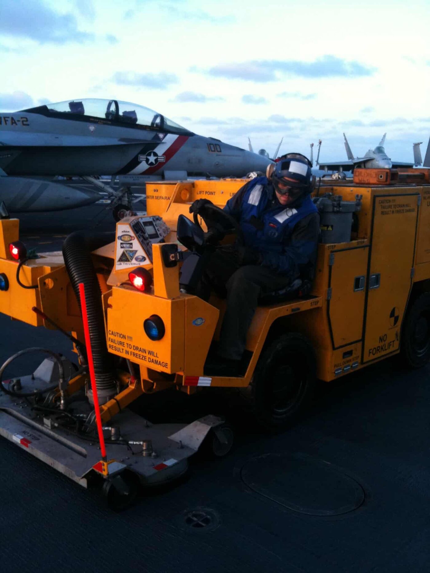 Aircraft carrier flight deck cleaning operations